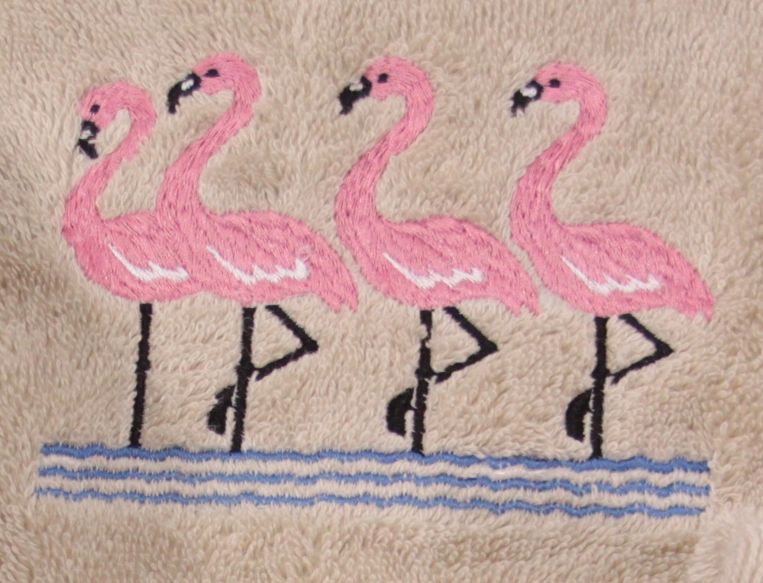Group of Flamingos on Embroidered Bath Towels