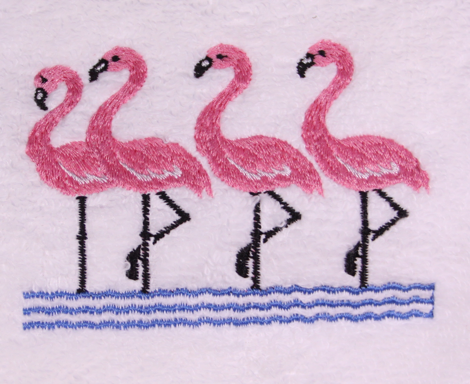 Group of Flamingos on Embroidered Bath Towels
